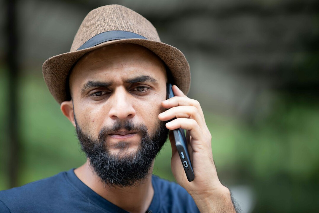 Portrait of a Hispanic man journalist with beard