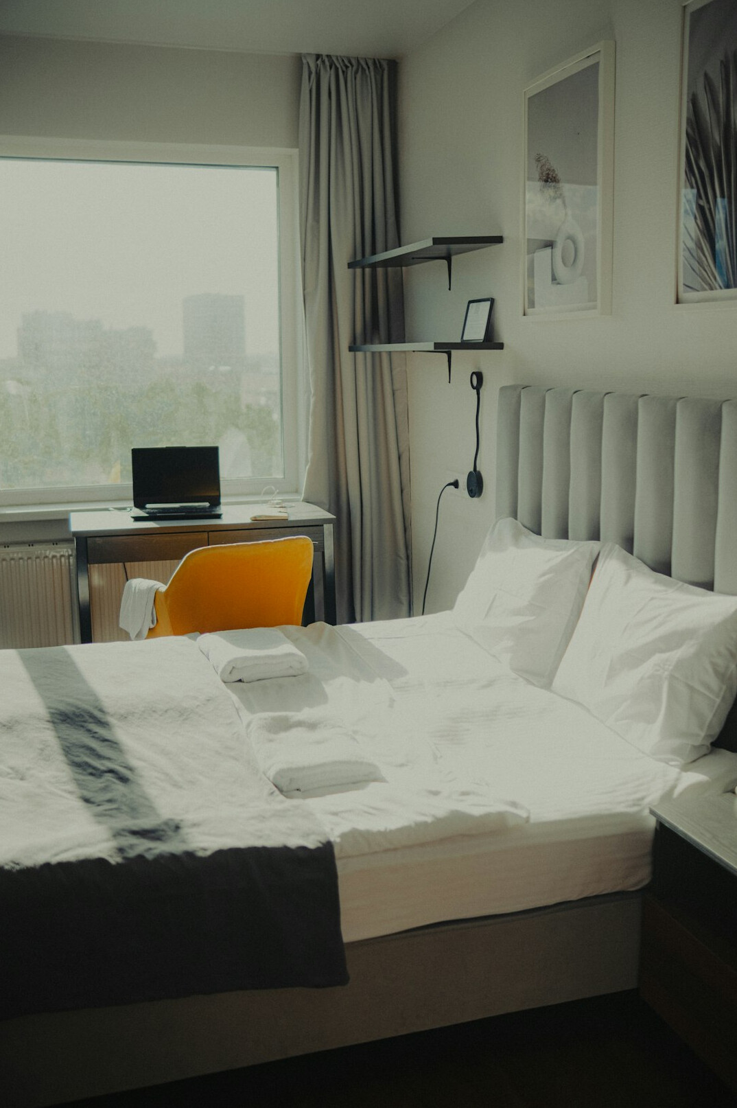 Desk with notebook and coffee near a window