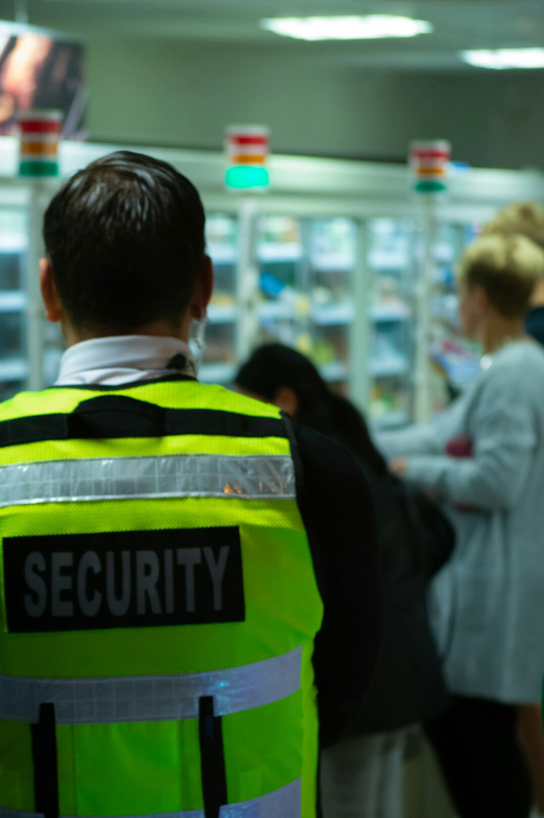store security guard watching customers